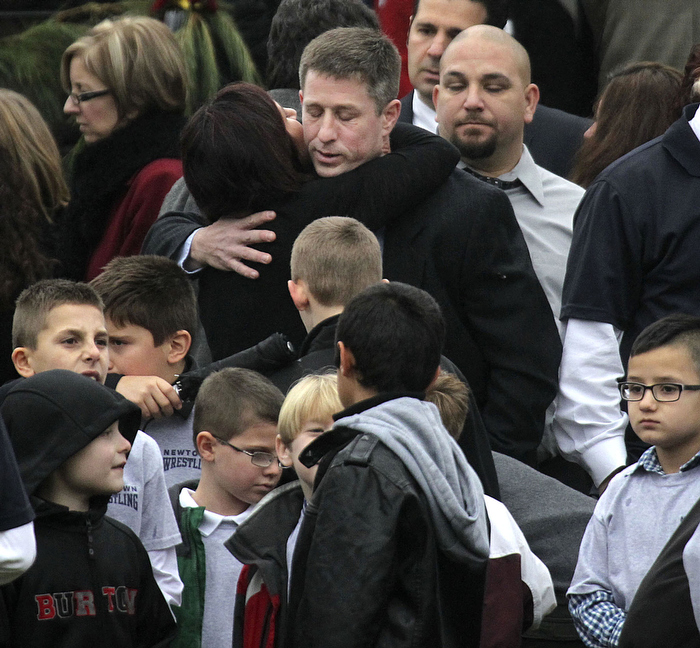 Newtown, CT - 12-17-12 - People outside of Honan Funeral Home on Main Street, Newtown during the funeral for Jack Pinto 6, who was killed in the school massacre on Friday.