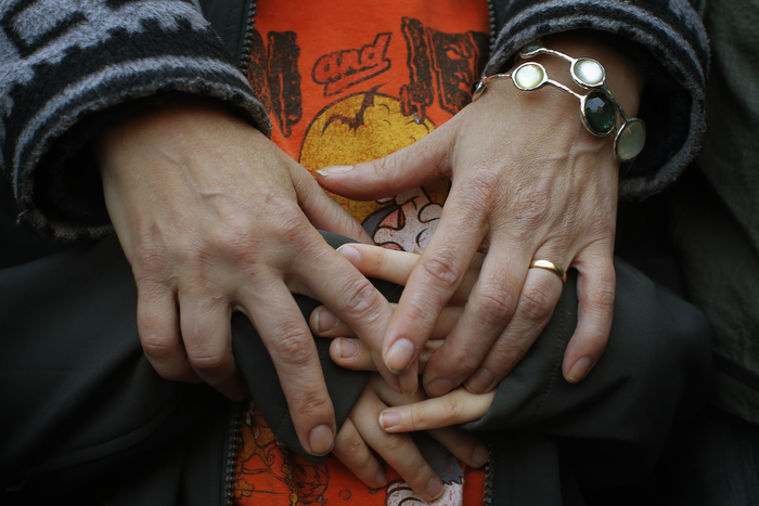A mother and her son attend an inter-faith worship service at a memorial on Boylston Street to the victims of the Boston Marathon bombings in Boston, Massachusetts April 21, 2013. Two explosions hit the Boston Marathon April 15 killing at least three people and injuring over 100 others.