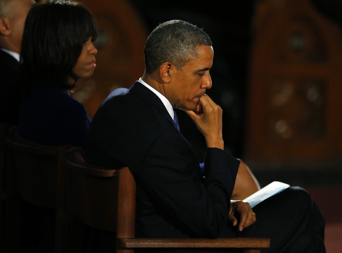 U.S. President Barack Obama and his wife Michelle attend an inter-faith memorial service for the victims of the bombing at the Boston Marathon in Boston, Massachusetts April 18, 2013. Two explosions hit the Boston Marathon as runners crossed the finish line on Monday killing at least three people and injuring over 100 others.