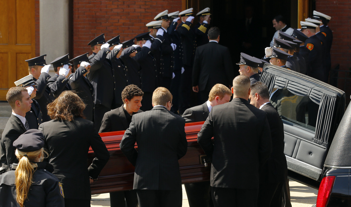 The casket containing the body of Krystle Campbel arrivesl at St. Joseph's Church for her funeral Mass in Medford, Massachusetts April 22, 2013. Krystle Campbell died in the two explosions that hit the Boston Marathon April 15 killing at least three people and injuring over 100 others.