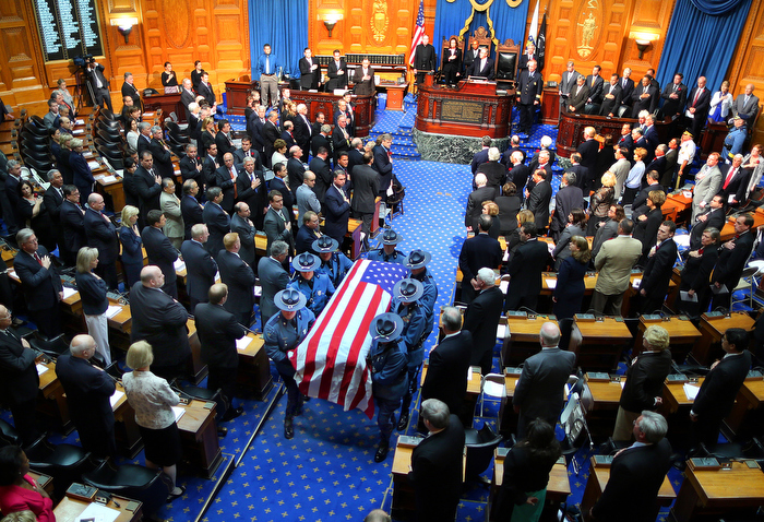 Boston-06/12313- A Remembrance for former Gov. Paul Cellucci was held at the State House House of Representatives, where friends, family and politicians attended. State Police pallbearers carry the casket after the service.