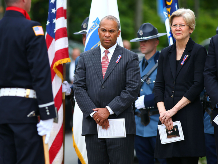 Hudson-06/14/13- A funeral mass was held at Saint Michael Church for former Gov. Paul Cellucci , where friends, family and politicians attended. Gov. Deval Patrick stands with US Senator Elizabeth Warren as the service lets out.