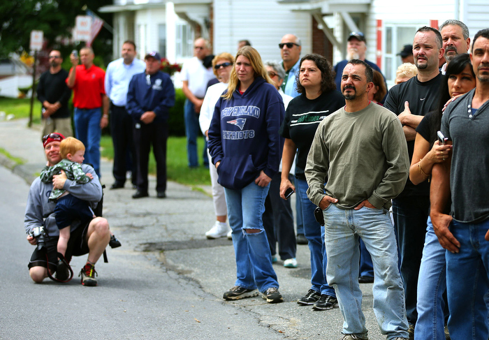 Hudson-06/14/13- A funeral mass was held at Saint Michael Church for former Gov. Paul Cellucci , where friends, family and politicians attended. People line the street outside the church to watch the procession. Boston