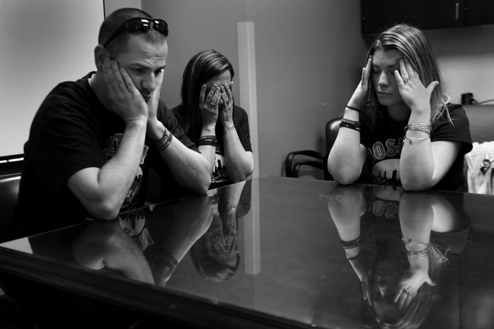 Family members of Marc Fucarile are devastated as Dr. Jeremy Goverman tells them in a conference room at the hospital that he may have to have his second leg amputated. l-r brother Edward Fucarile, sister Stephanie Baron, and fiancée Jen Regan.