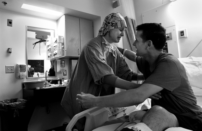 In tears, nurse Amanda Heidbreder says goodbye to Marc in his hospital room during his discharge to the Spaulding Rehabilitation Hospital. Marc, a charmer with time for everybody, instantly became a hit with the hospital staff during his stay.