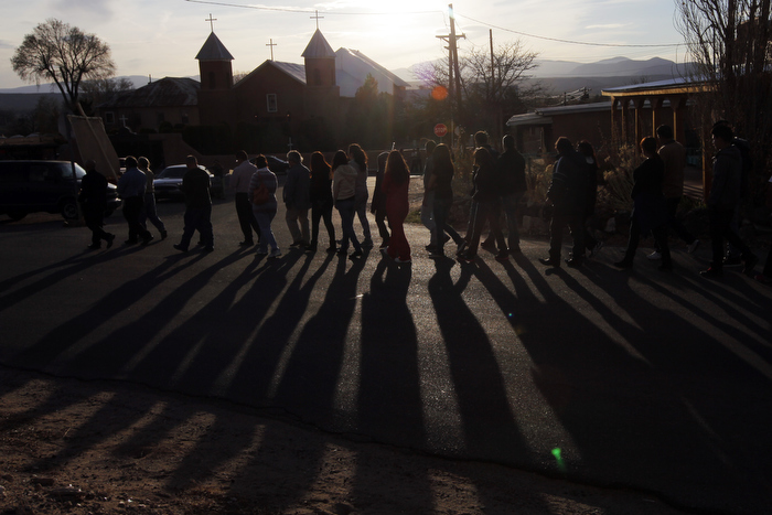 The faithful follow Hermanos from La Morada de Santa Cruz in a procession to Mass at Holy Cross Catholic Church in Santa Cruz, New Mexico March 28, 2013. The Hermanos are part of a centuries old lay Catholic group of men in northern New Mexico.