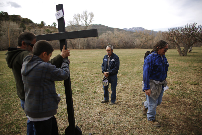 Volunteers take down a cross following a Stations of the Cross stop during a Good Friday pilgrimage in Talpa, New Mexico March 29, 2013. Several hundred followers of the Catholic Church walked a pilgrimage celebrating the Stations of the Cross from the San Francisco de Asis Catholic Church, through Ranchos de Taos and the remote village Talpa, New Mexico.