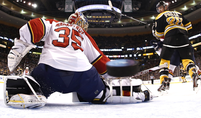 Apr 21, 2013; Boston, MA, USA; Florida Panthers goalie Jacob Markstrom (35) can't stop this goal by Boston Bruins' Dougie Hamilton (not seen) as Boston Bruins left wing Daniel Paille (20) looks on during the second period of a NHL game.