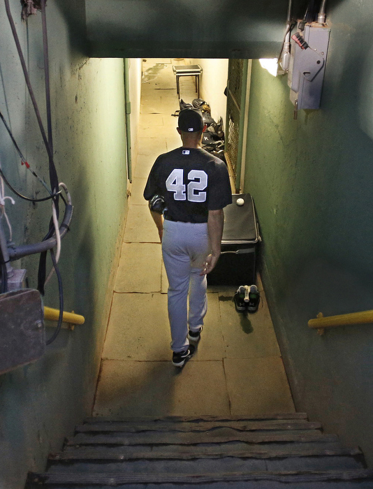 New York Yankees closer Mariano Rivera walks down into the the tunnel before his last game against the Boston Red Sox at Fenway Park