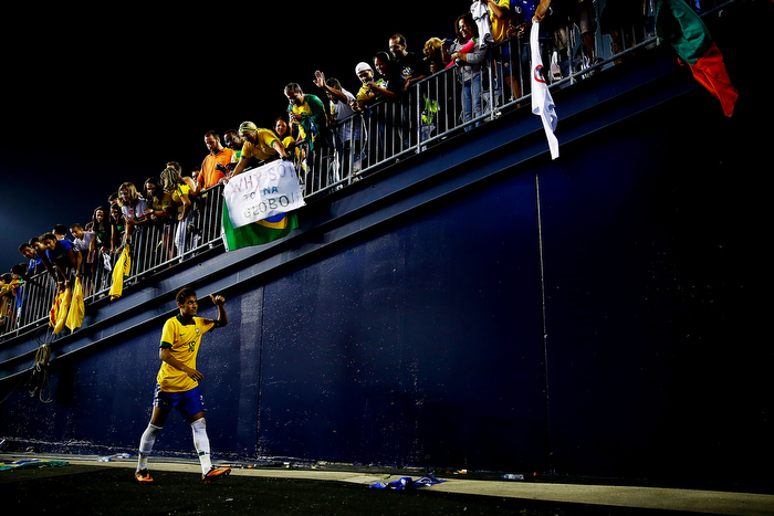 Neymar #10 of Brazil walks off of the field and through the tunnel past cheering fans following their 3-1 win against Portugal during the international friendly match at Gillette Stadium on September 10, 2013 in Foxboro, Massachusetts.