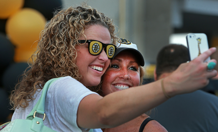 Lauren Palmacci (left) and her sister Lia Palmacci, season ticket holders from Groton, MA take a picture of themselves outside the Garden before the game. The Boston Bruins hosted the Chicago Blackhawks for Game Six of the Stanley Cup Finals at the TD Garden.
