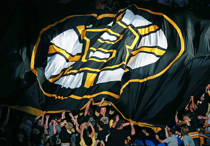 Fans pass a giant Bruins banner through the crowd before the game. The Boston Bruins hosted the Chicago Blackhawks for Game Six of the Stanley Cup Finals at the TD Garden.