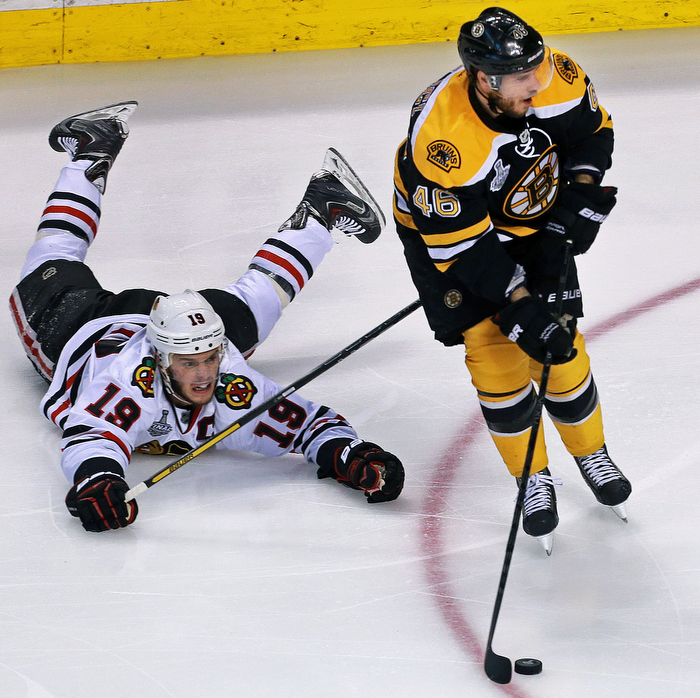 The Bruins David Krejci leaves Chicago' Jonathan Toews on the ice and in his wake. The Boston Bruins hosted the Chicago Blackhawks for Game Six of the Stanley Cup Finals at the TD Garden.
