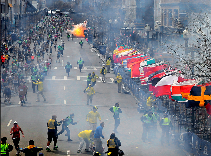 BOSTON, MA. 04/ 15 /13: The second bomb explodes as runners approach the finish line at the 117th Boston Marathon.