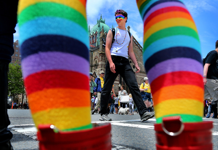 Boston-06/08/13- A woman's rainbow stocking frame participants on Boylston st. in Copley Sq. during the annual Boston Pride annual parade, which winded 2.6 miles from Copley Square, through the South End to the Boston Common with over 15,000 marchers.