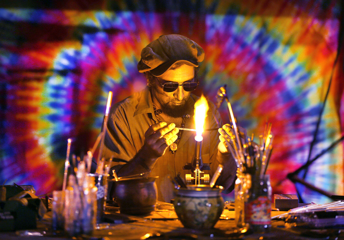 Marshfield-08/18/13 _The annual Marshfield Fair is underway and runs through August 25th. Oli Elia works on a blown glass piece in his booth.