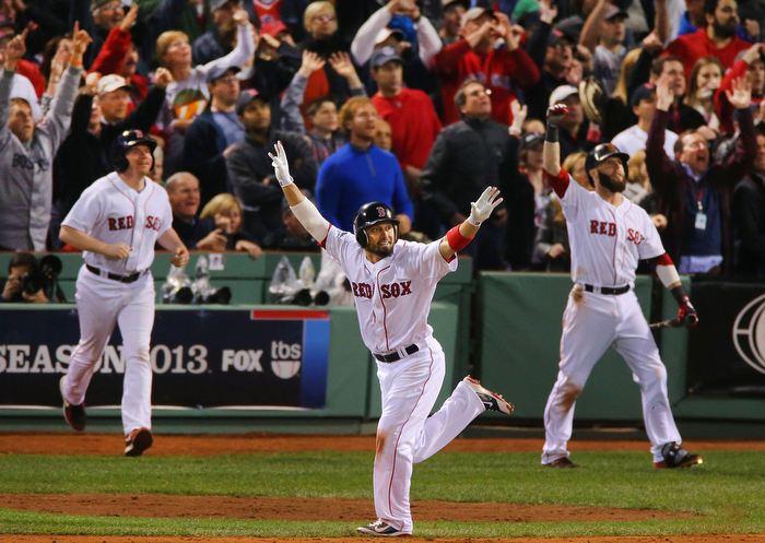 Boston-10/19/13-- ALCS game 6 Red Sox vs Tigers, Sox Shane Victorino celebrates his 7th inning grand slam as he heads to 1st base, Dustin Pedroia(rear) cheers on.