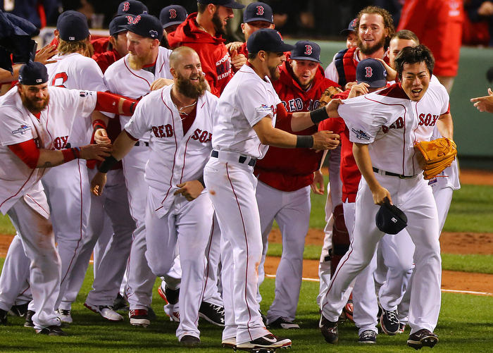 Boston-10/19/13-- ALCS game 6 Red Sox vs Tigers, Sox players ran to the pitcher's mound to celebrate with relief pitcher Koji Uehara after they defeated the Tigers.