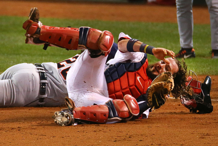 Boston-10/19/13-- ALCS game 6 Red Sox vs Tigers, Sox Jarrod Saltalamacchia rolls over Tigers Prince Fielder after tagging him out in the 6th inning in a rundown between home and 3rd base.