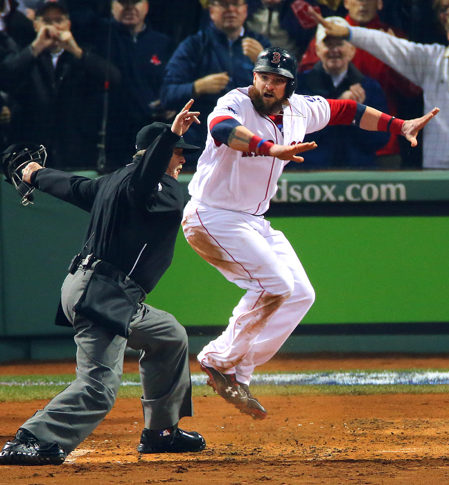 Boston-10/30/13--World Series game 6- Jonny Gomes is signaled safe by the home umpire as he scored in the 3rd inning on a Shane Victorino 3-run rbi double.