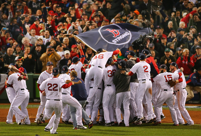 Boston-10/30/13--World Series game 6- Jubilant Red Sox celebrate after beating the Cardinals to win the World Series at Fenway Park.