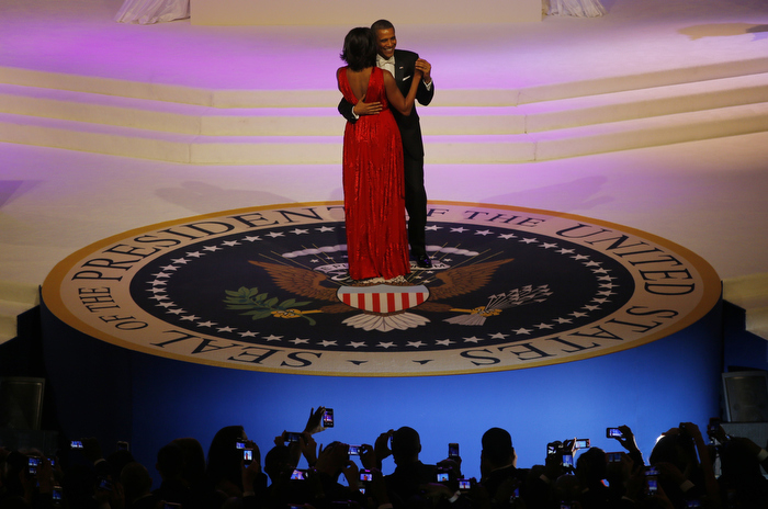 U.S. first lady Michelle Obama, wearing a Jason Wu dress, dances with U.S. President Barack Obama at the Commander in Chief's ball in Washington, January 21, 2013.