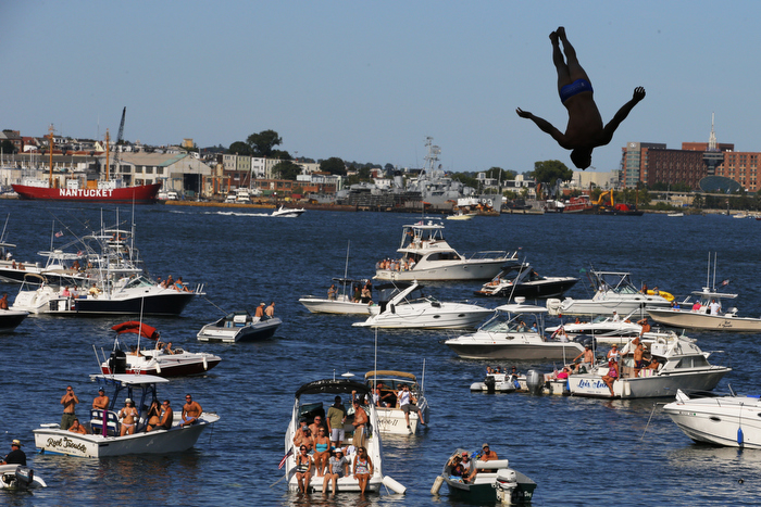 Michal Navratil of the Czech Republic dives off the roof of the Institute of Contemporary Art during the Red Bull Cliff Diving World Series 2013 competition in Boston, Massachusetts August 20, 2011. Divers plunge some 90 feet from the roof of the contemporary art museum into Boston Harbor.