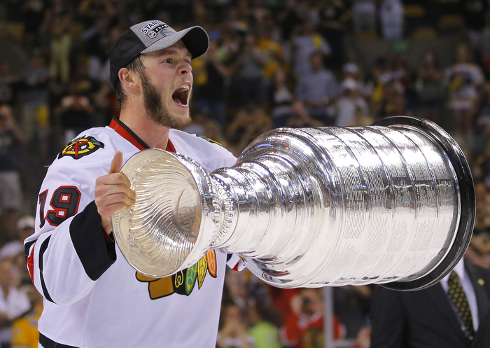 Chicago Blackhawks' Jonathan Toews celebrates with the Stanley Cup after his team defeated the Boston Bruins in Game 6 of their NHL Stanley Cup Finals hockey series in Boston, Massachusetts, June 24, 2013.