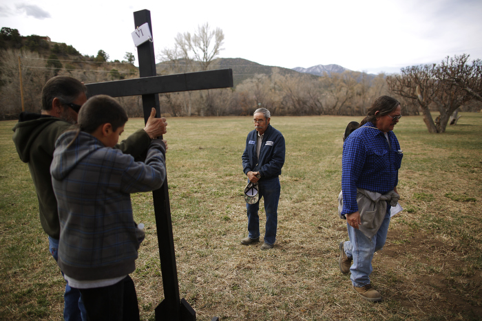 Volunteers take down a cross following a Stations of the Cross stop during a Good Friday pilgrimage in Talpa, New Mexico March 29, 2013. Several hundred followers of the Catholic Church walked a pilgrimage celebrating the Stations of the Cross from the San Francisco de Asis Catholic Church, through Ranchos de Taos and the remote village Talpa, New Mexico.
