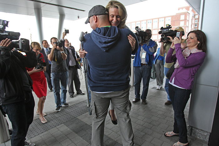 Charlestown MA., 05/14/13, Boston Marathon bombing survivor and amputee Roseann Sdoia was released from Spaulding Rehabilitation Hospital and was escorted to North End home by fire engines. Boston Firefighter Mike Materia, is credited with helping to save Roseann Sdoia,cq, after the marathon bomb attack. He transporterd her in a police prisoner transport van when there were no ambulances. He held her hand and also held tight to her tourniquet to save her life. She lost a leg, but gained new friends, a new appreciation for life and a life-long gratitude to those how saved her life. At the end of the press conference, the hero firefighter picked her up to hug her.