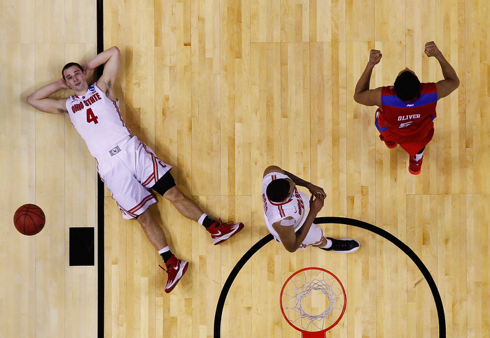 BUFFALO, NY - MARCH 20: Aaron Craft #4 of the Ohio State Buckeyes reacts after losing to the Dayton Flyers 60-59 in the second round of the 2014 NCAA Men's Basketball Tournament at the First Niagara Center on March 20, 2014 in Buffalo, New York.