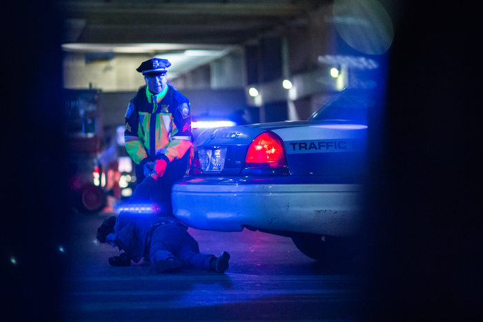 November 25, 2014 – A police officer arrests a woman during a protest in Boston, Mass., after the grand jury in Ferguson, Mo., decided not to indict Officer Wilson.