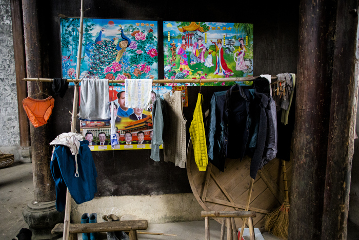 Poster seen in a villager's house in Huangtian village, showing Chairman Mao and central committee members from the ruling Communist Party, January 6, 2015.