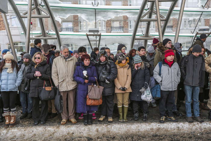 Dozens of MBTA commuters crowded Kenmore Square station waiting for shuttle buses after green line service was halted. The MBTA reported major delays throughout the system due to the high amounts of snow and low temperatures.