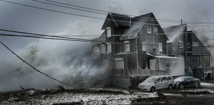 Waves pound ocean front homes in the Brant Rock section of Marshfield during a winter blizzard. Many homes were damaged or destroyed.