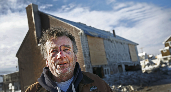 Brant Rock, Marshfield resident and commercial fisherman Tim Mannix talks about how he was injured in his home while trying to secure sliding doors during the height of a blizzard. He received dozens of stitches and a broken nose when waves crashed through the doors. His home was severely damaged.