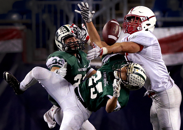 Dartmouth's Luke Espindola (25) breaks up a long pass intended for Melrose wide receiver Mike Pedrini in the Division 3 high school Super Bowl at Gillette Stadium.