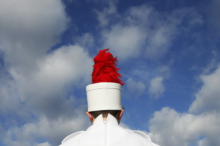 A member of the Bridgewater-Raynham marching band warmed up before the start of the Thanksgiving day high school football game between Brockton at Bridgewater-Raynham in Bridgewater, Massachusetts November 26, 2015.