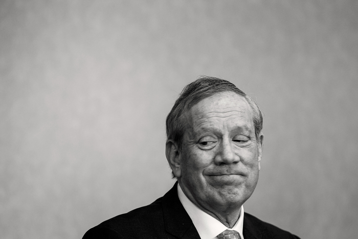 Republican presidential candidate George Pataki pauses before responding to a question being posed during a Q&A at a Portsmouth, NH business leaders luncheon.