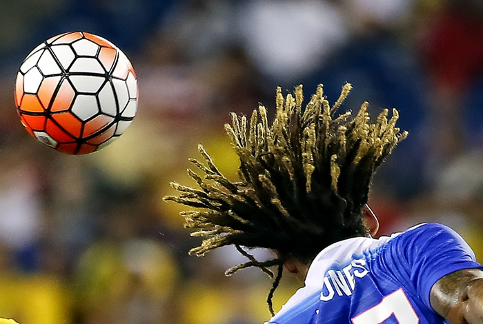 United States midfielder Jermaine Jones heads the ball away during their game against Brazil at Gillette Stadium.